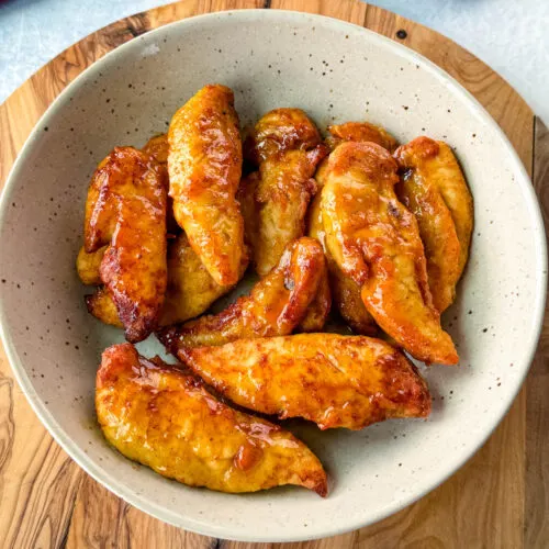 hot honey chicken tenders in a brown bowl