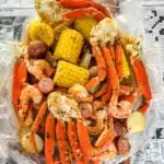 seafood boil in a bag wih snow crab clusters, shrimp, potatoes, corn on the cob and sausage