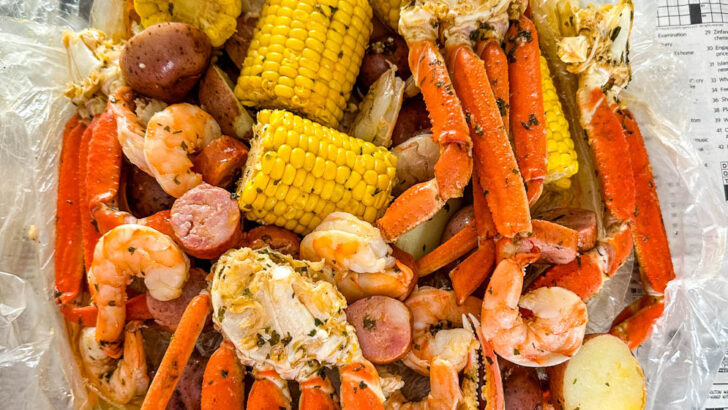 seafood boil in a bag wih snow crab clusters, shrimp, potatoes, corn on the cob and sausage