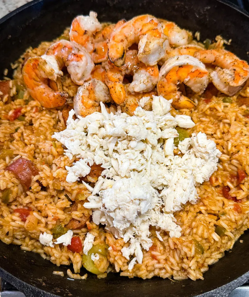 Creole shrimp jambalaya with crab in a cast iron skillet