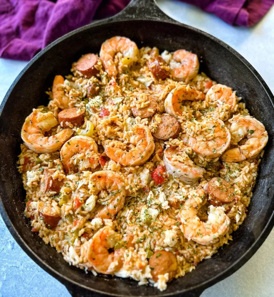 Creole shrimp jambalaya with crab in a cast iron skillet