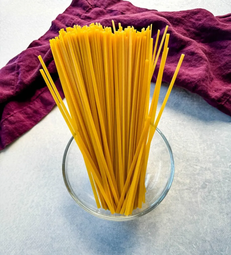 dry Fettuccine pasta in a glass bowl