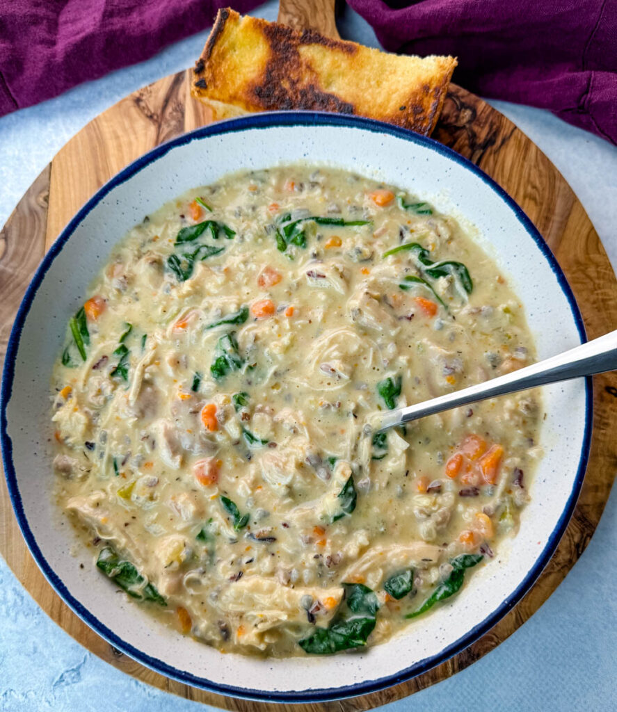 chicken wild rice soup in a white bowl with a spoon