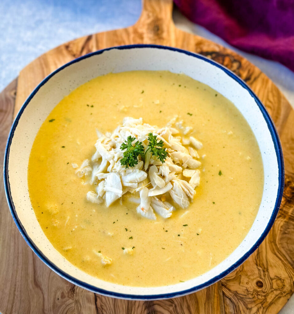 crab bisque in a white bowl with lump crab meat and flour