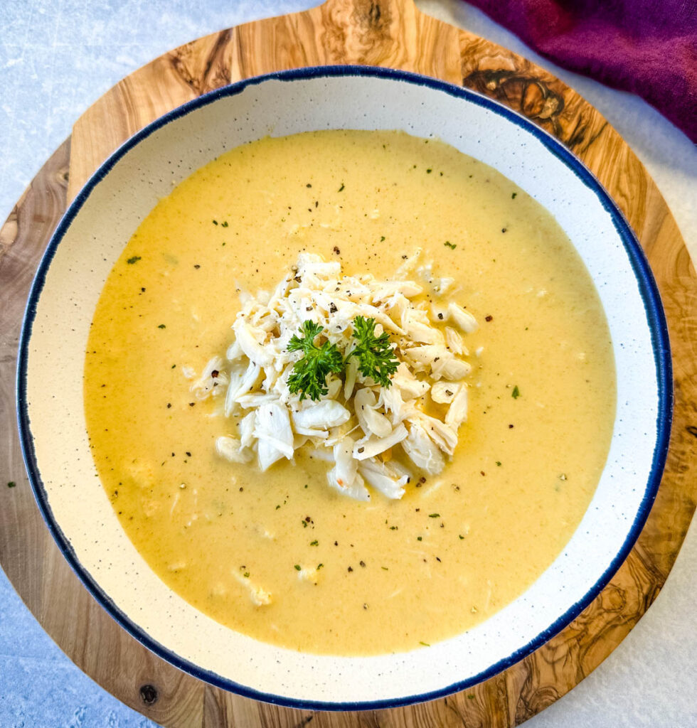 crab bisque in a white bowl with lump crab meat and flour