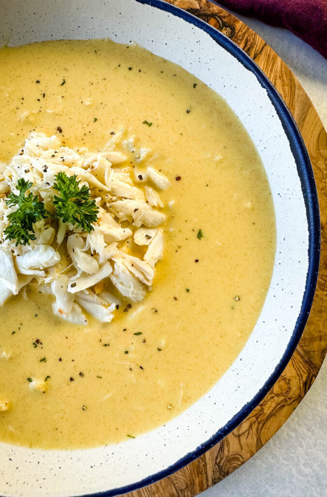 crab bisque in a white bowl with lump crab meat and flour