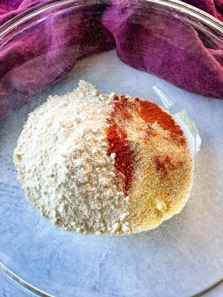 cornmeal, flour, and spices in a glass bowl