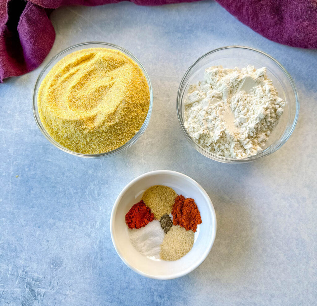 yellow cornmeal, all purpose flour, and spices in separate bowls