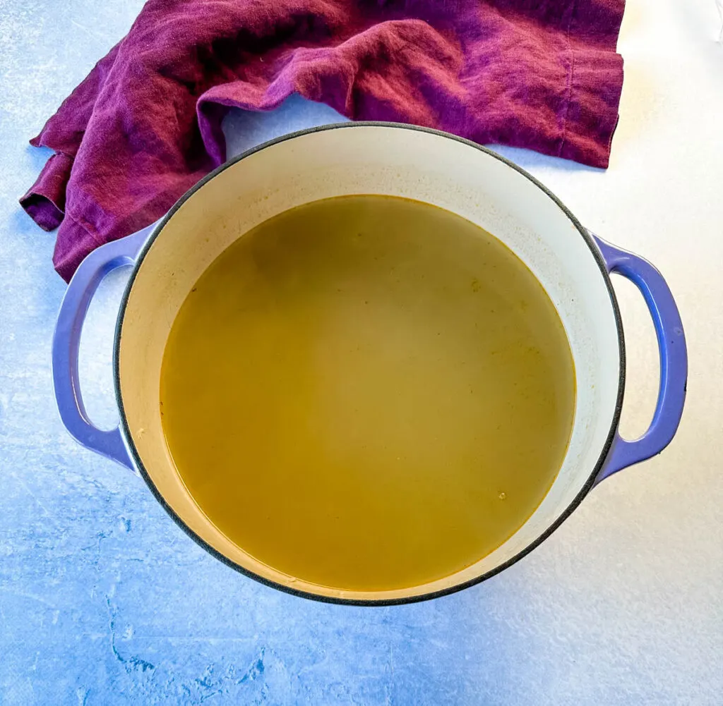 homemade seafood stock in a Dutch oven