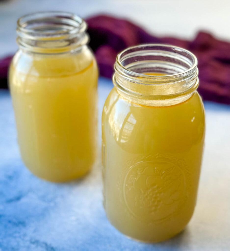 homemade seafood stock in glass mason jars