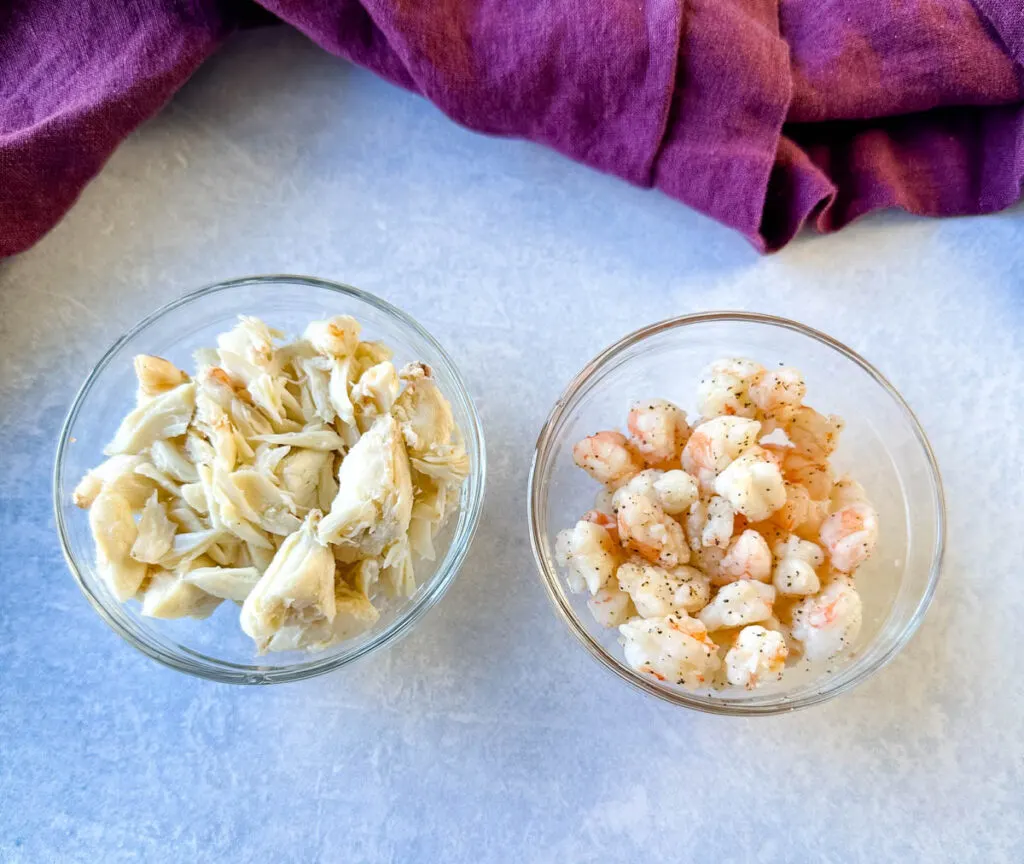 jumbo lump crab and cooked diced shrimp in separate glass bowls