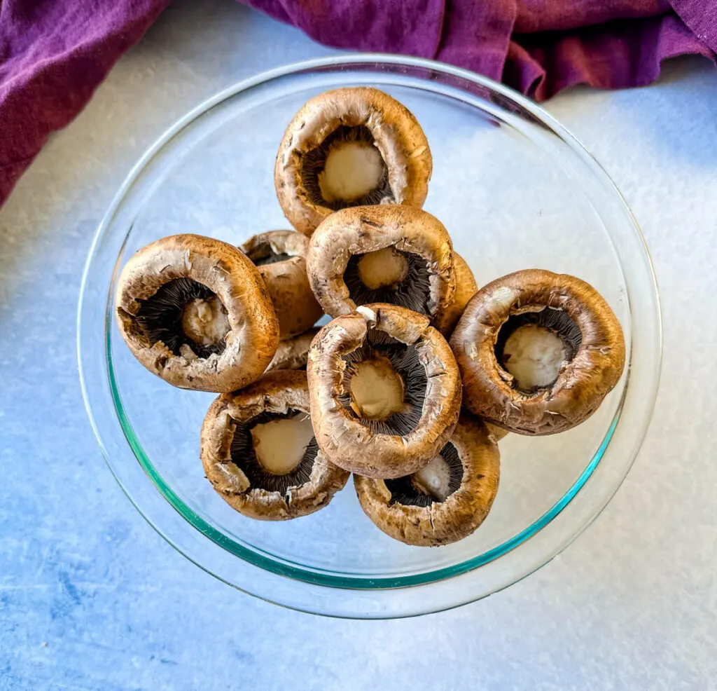 baby bella mushrooms in a glass bowl