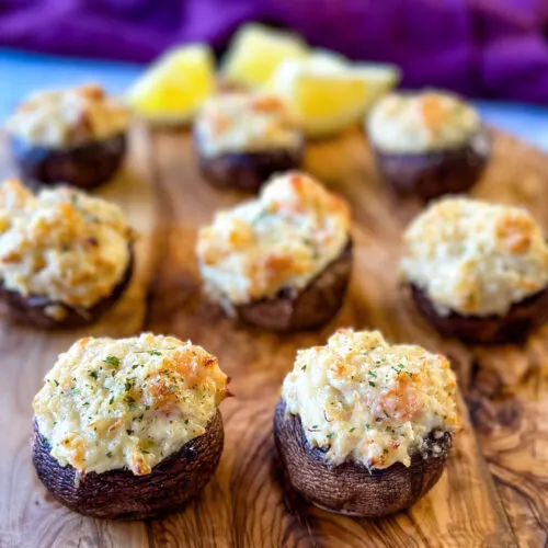 seafood stuffed musharooms with crab and shrimp on a flat surface