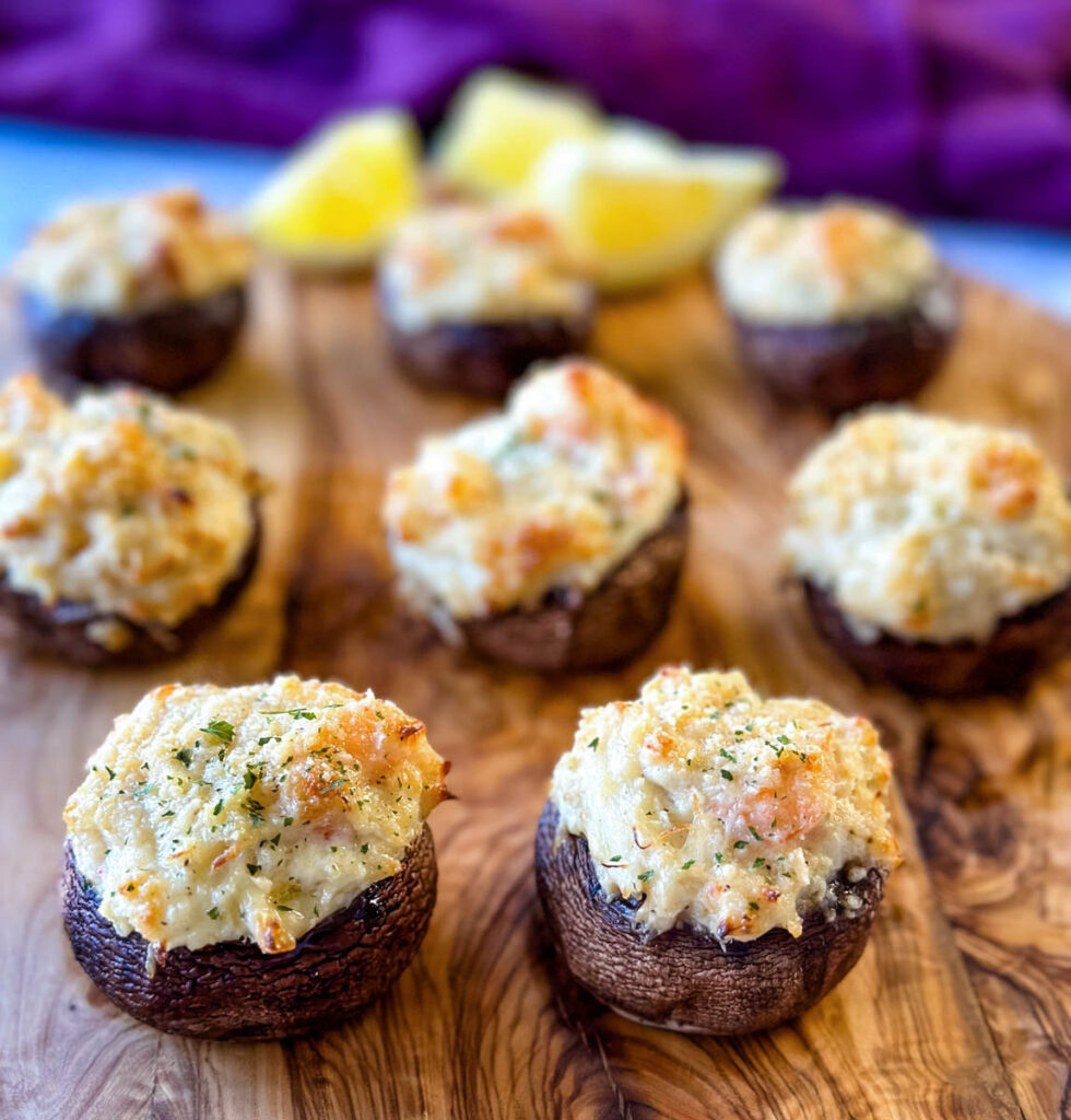 seafood stuffed musharooms with crab and shrimp on a flat surface