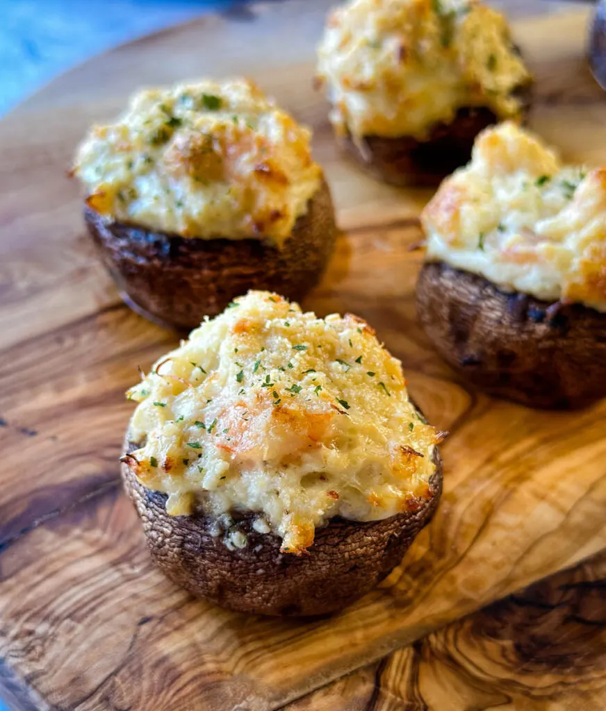 seafood stuffed mushrooms with crab and shrimp on a flat surface