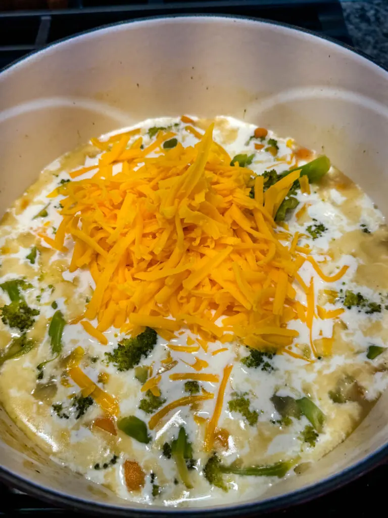 uncooked broccoli cheddar soup in a Dutch oven