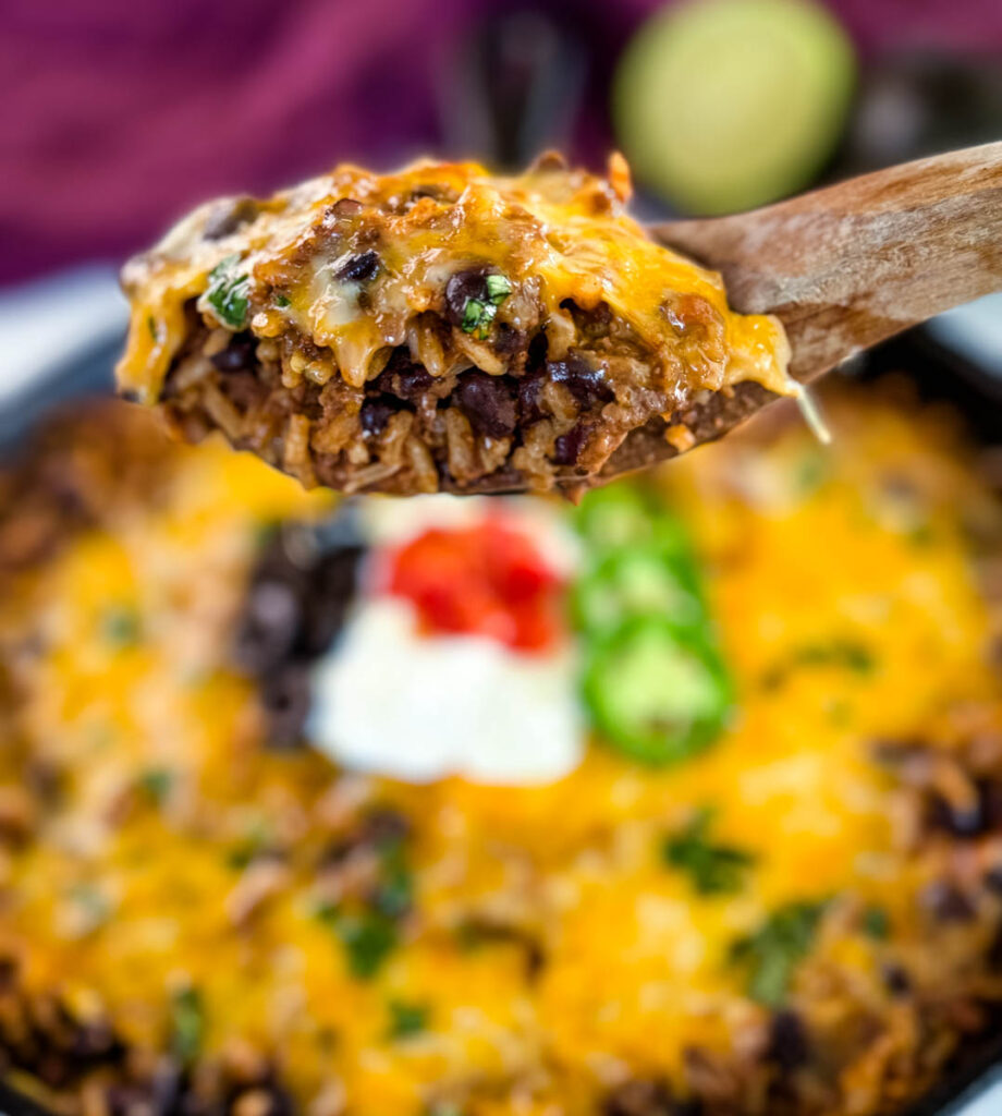 a wooden spoonful of Mexican beef and rice