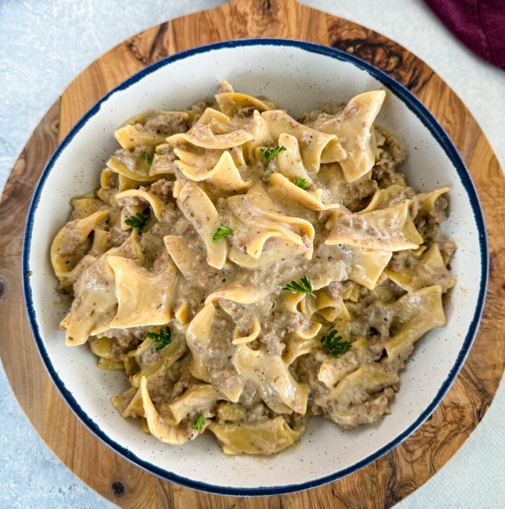 beef and noodles in a white bowl