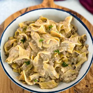 beef and noodles in a white bowl