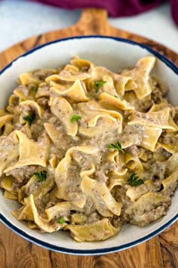 beef and noodles in a white bowl