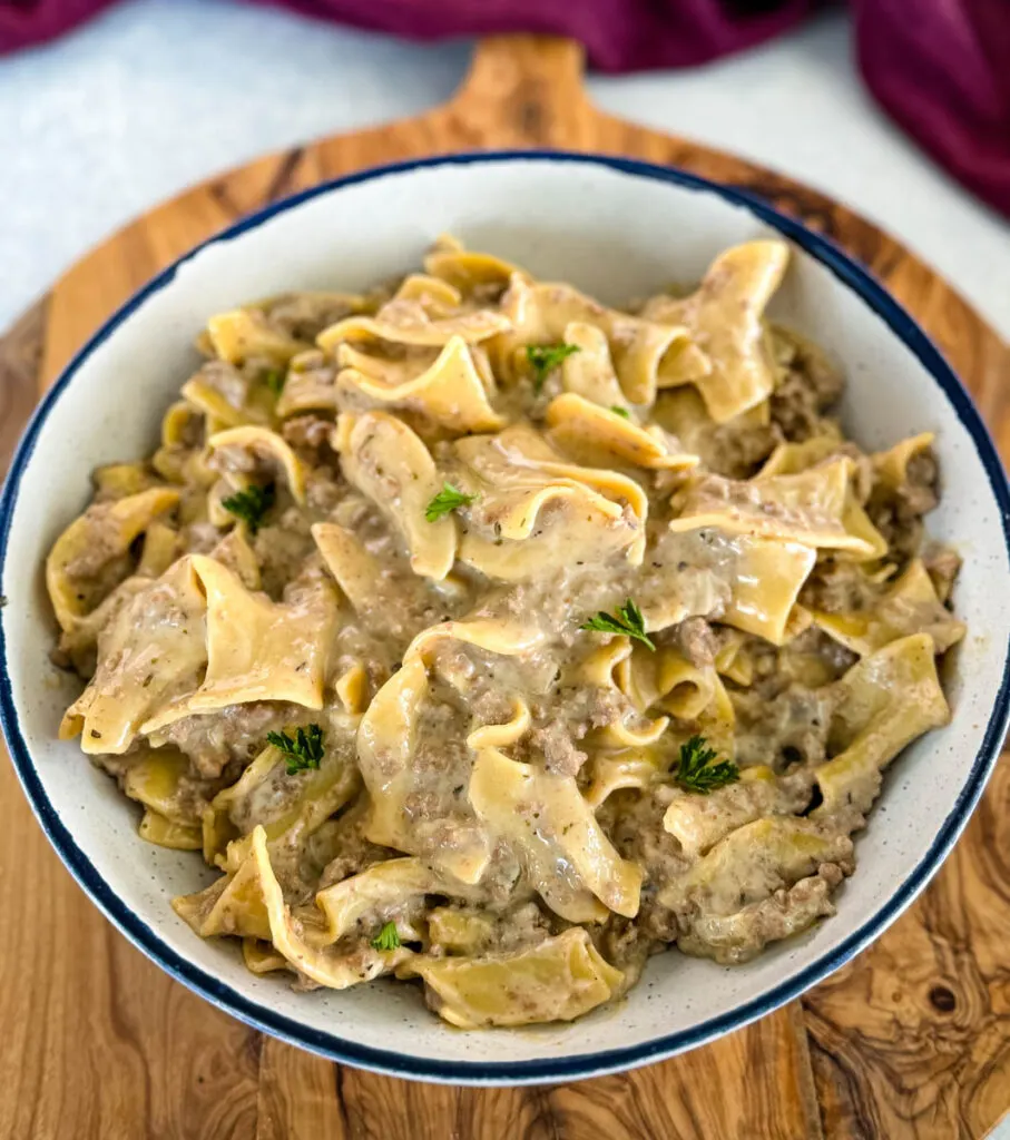 beef and noodles in a white bowl