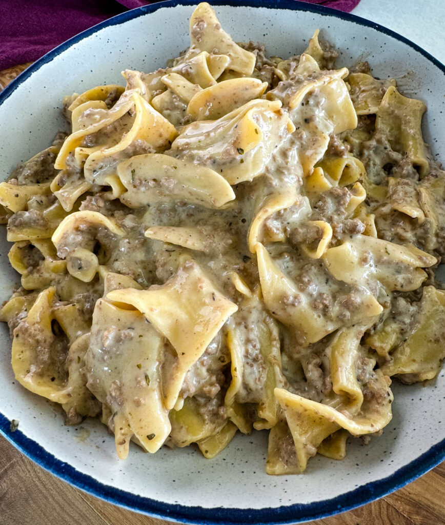 beef and noodles in a white bowl