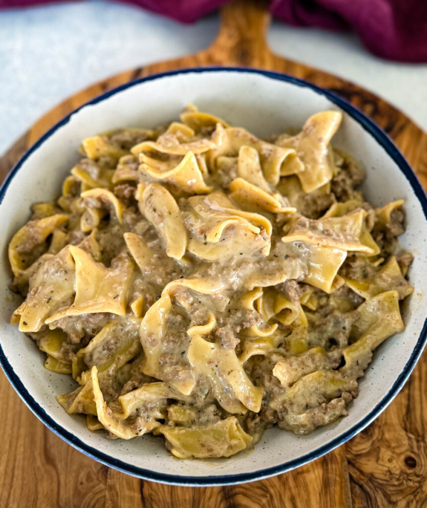 beef and noodles in a white bowl