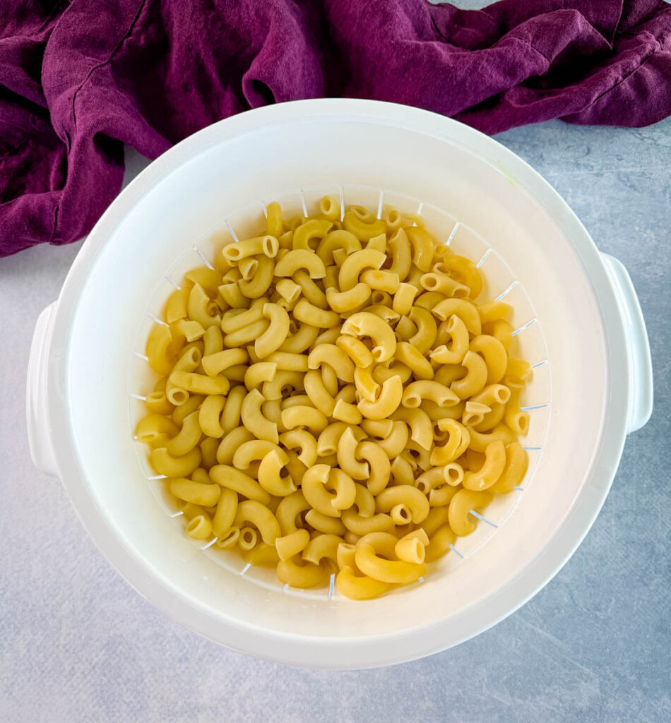 cooked elbow pasta in a colander