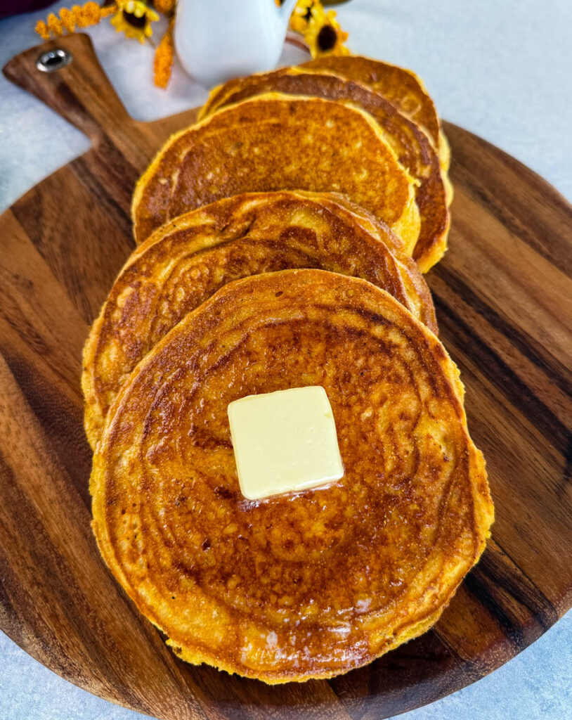 fried cornbread with butter on a plate