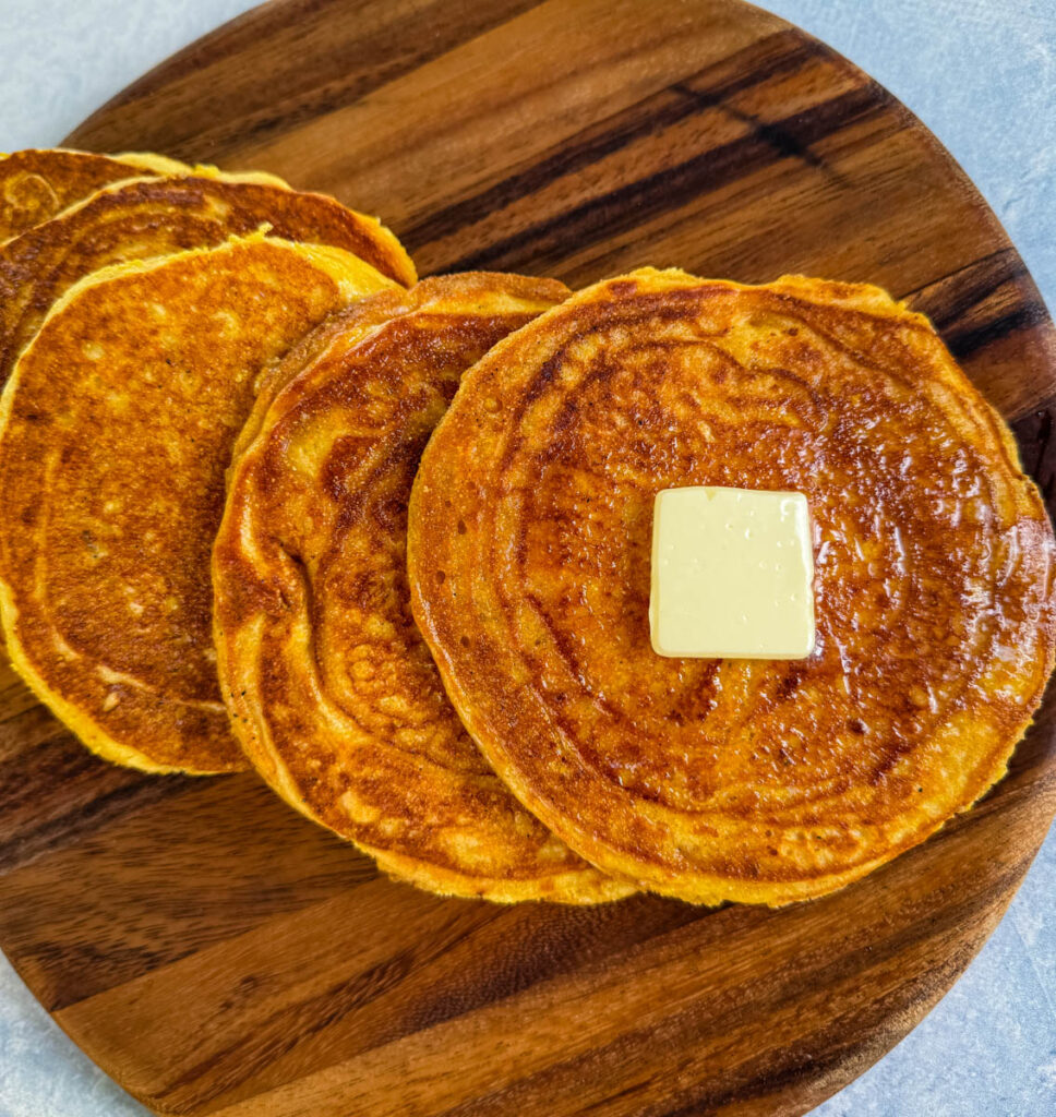 fried cornbread with butter on a plate