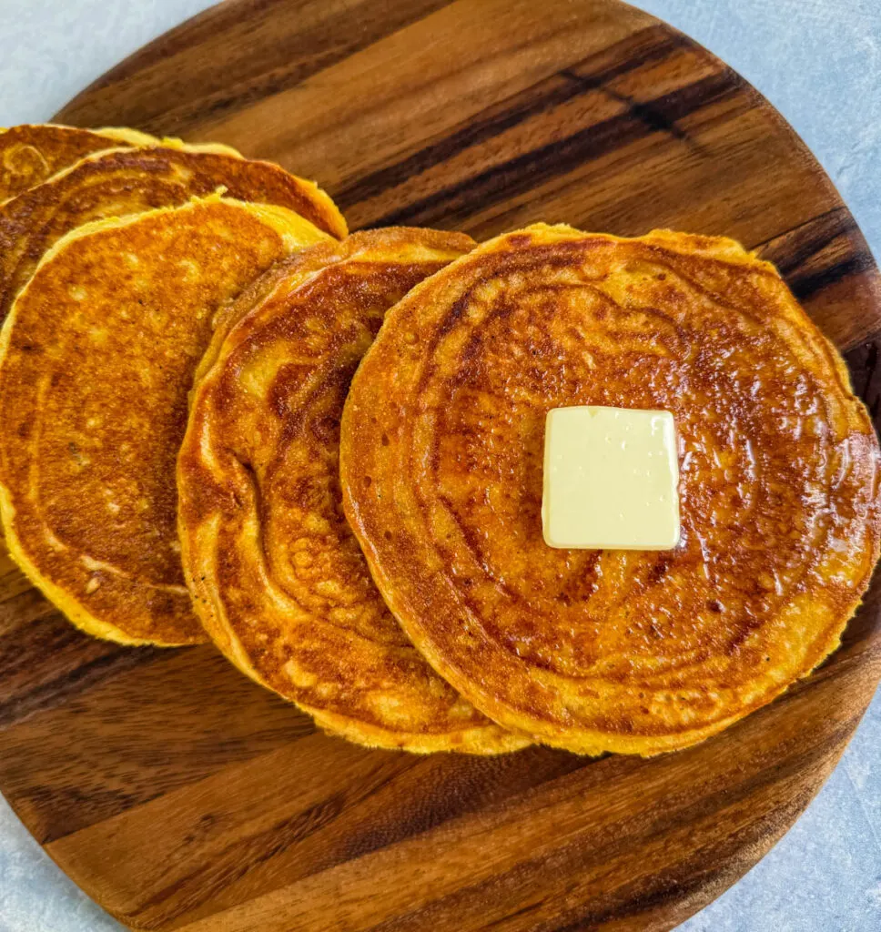 fried cornbread with butter on a plate