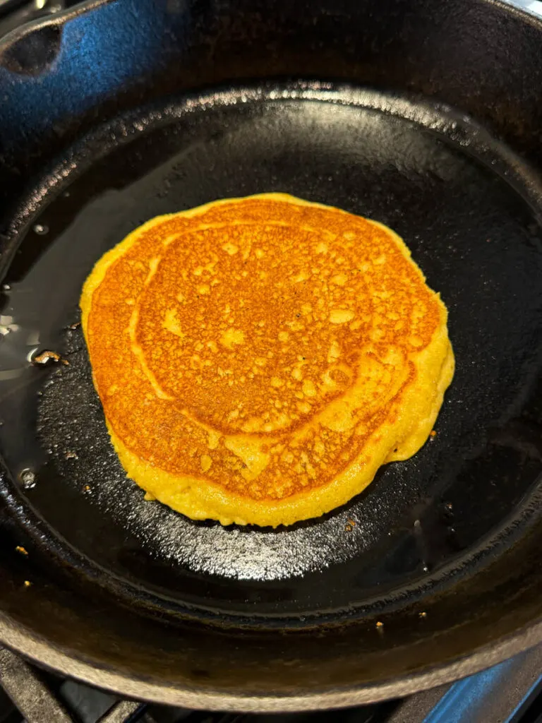 fried cornbread in a cast iron skillet