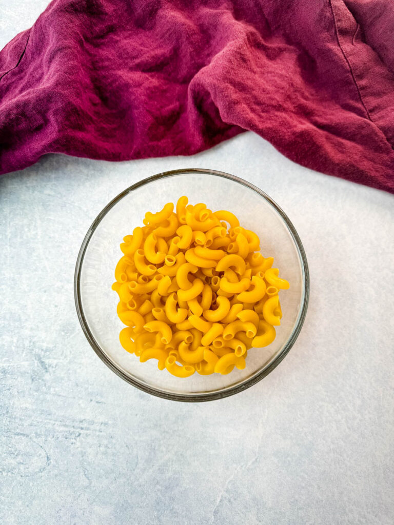 elbow macaroni pasta in a glass bowl