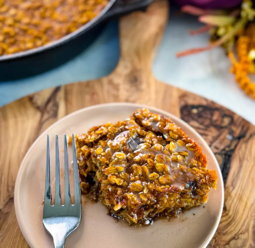 pumpkin baked oatmeal with chocolate chips on a plate with a fork