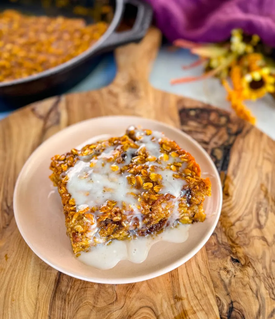 pumpkin baked oatmeal with on a plate drizzled with icing