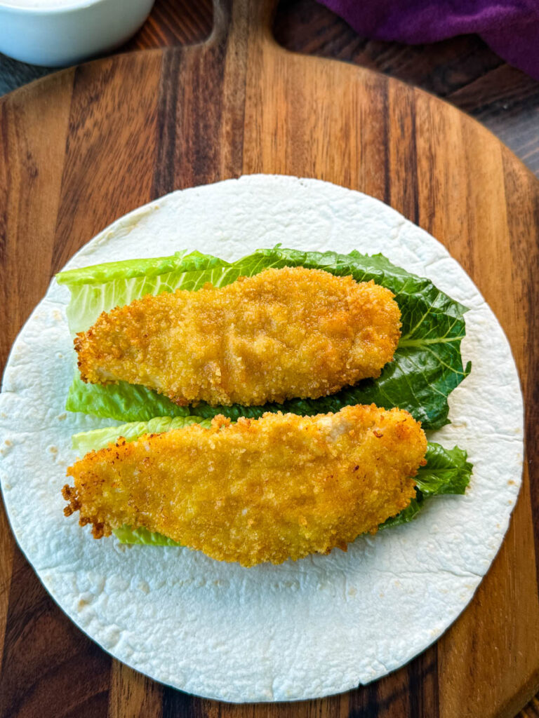 crispy chicken and lettuce on a tortilla