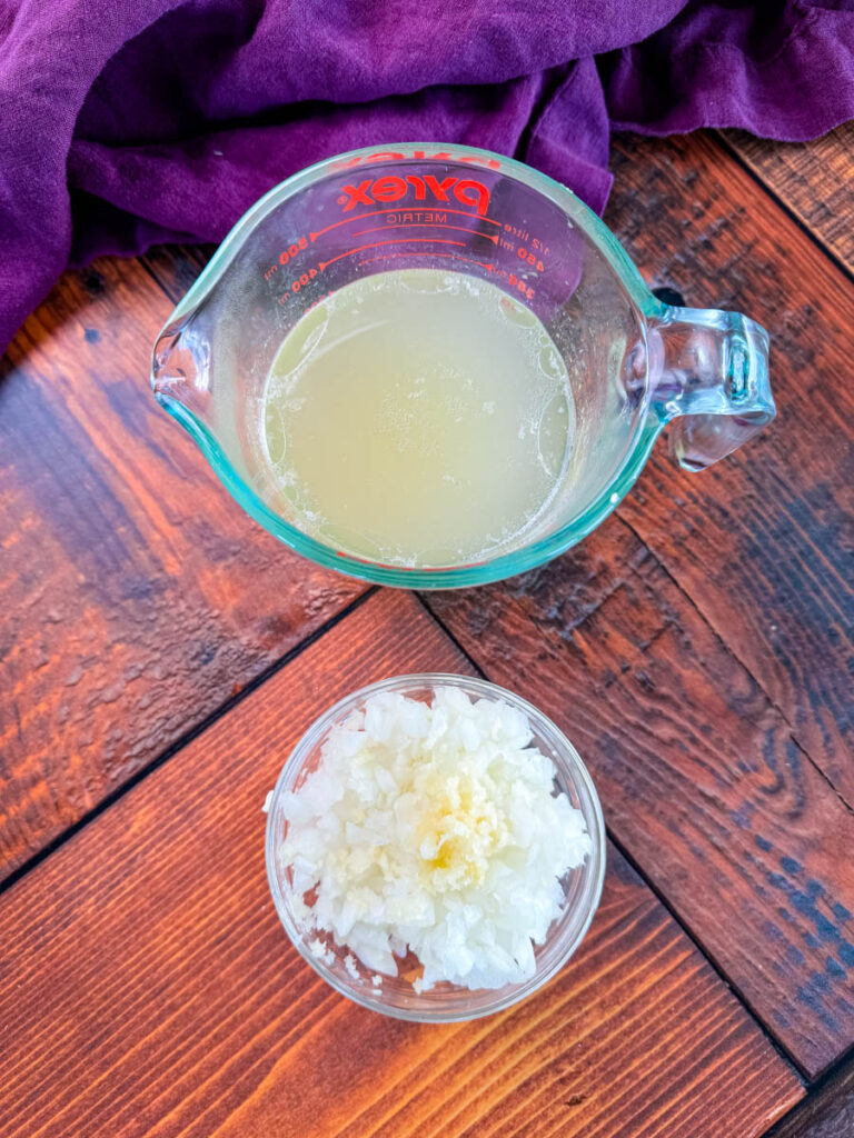 chicken broth, diced onions, and minced garlic in separate bowls