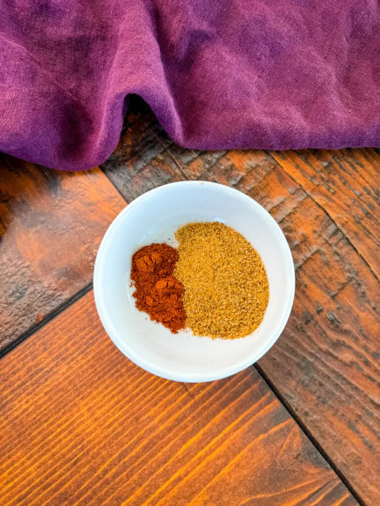 Creole Seasoning and smoked paprika in a white bowl