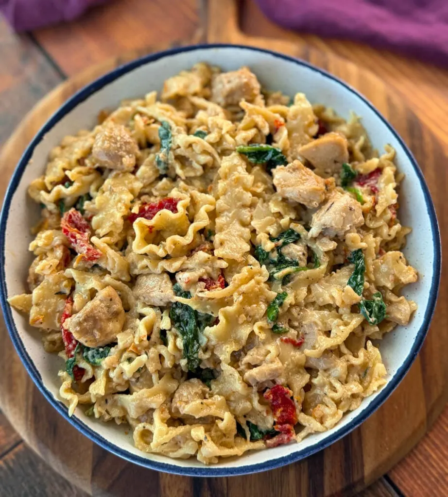 bowl marry me chicken pasta with sundried tomatoes, parmesan, and spinach