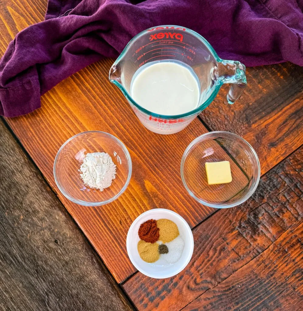 heavy cream, flour, butter, and spices in separate bowls