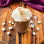 slow cooker Crockpot hot chocolate in a mug with whipped cream and marshmallows