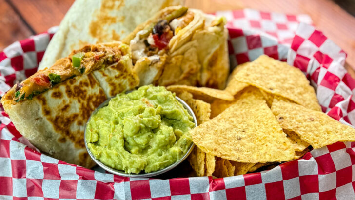 high protein chicken burritos, guacamole, and chips in a bowl