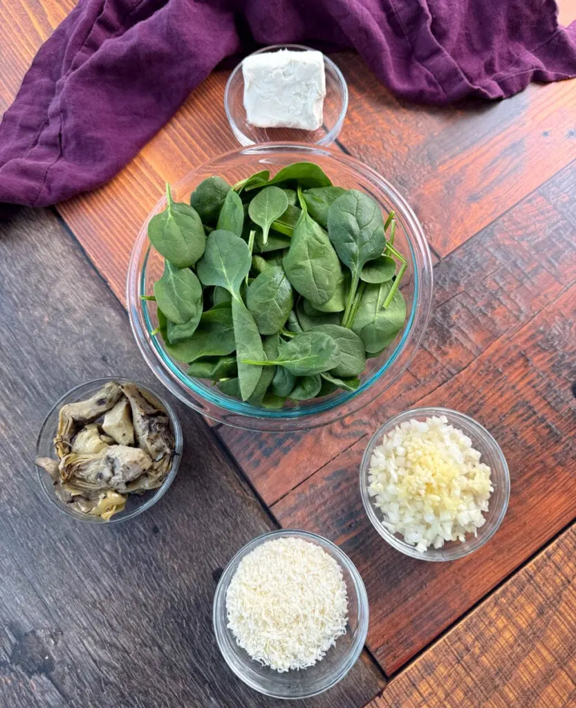 cream cheese, fresh spinach, artichokes, grated Parmesan, and cream cheese in separate bowls